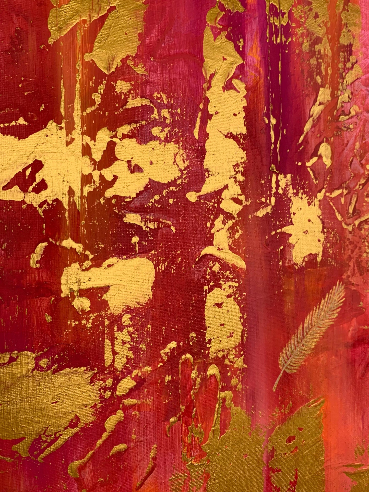 Close-up detail of vibrant pink and gold acrylic painting, modern wall décor.