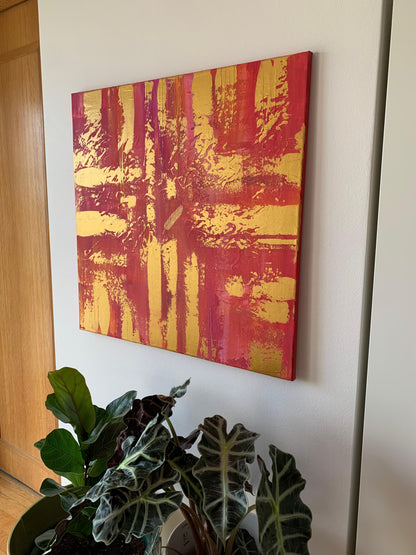 Large abstract canvas with textured brushwork in bold golden hues.